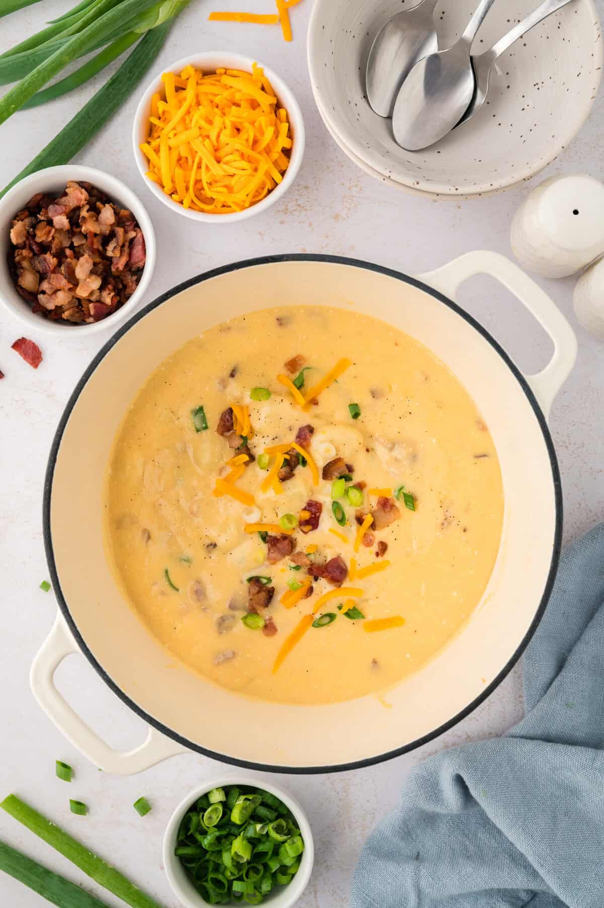 Loaded gnocchi soup topped with bacon and green onions.