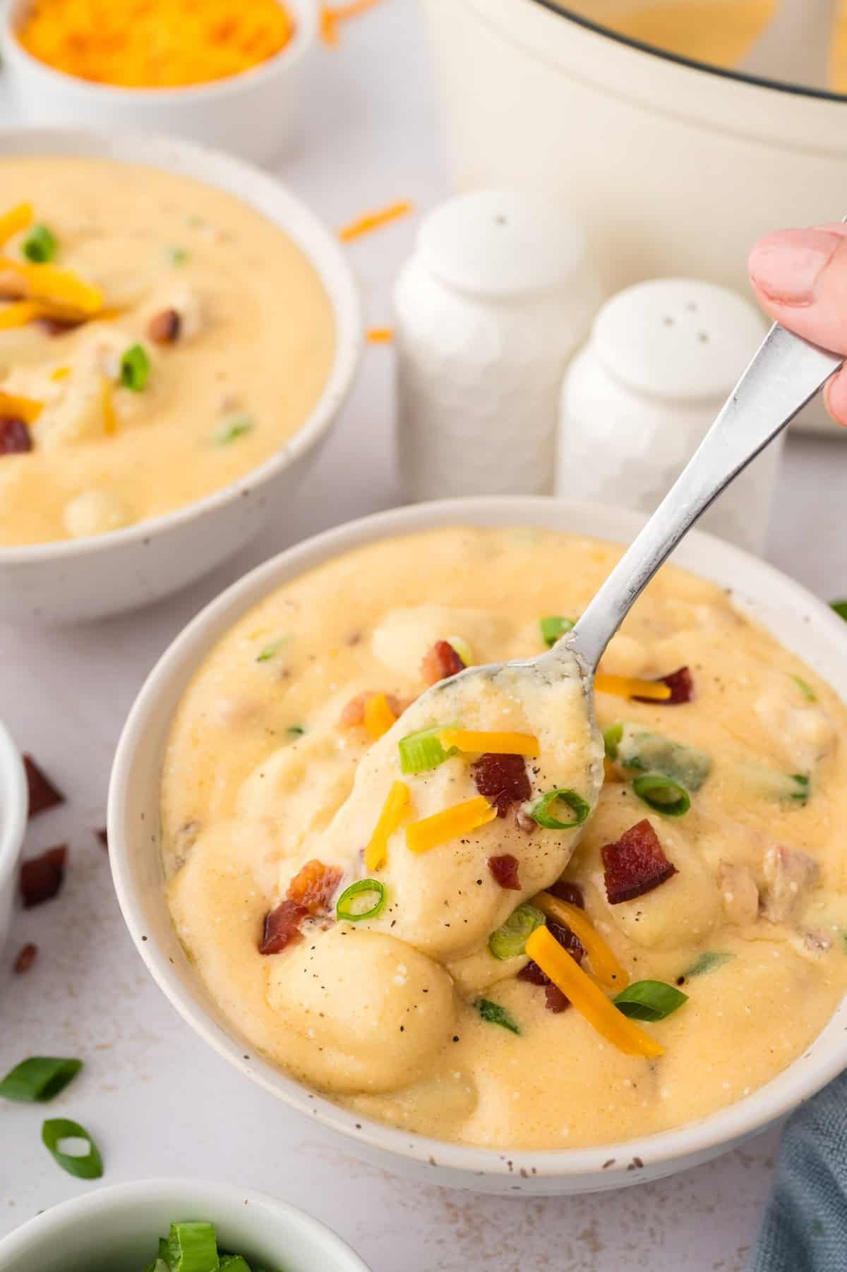 Creamy loaded gnocchi soup in bowl.