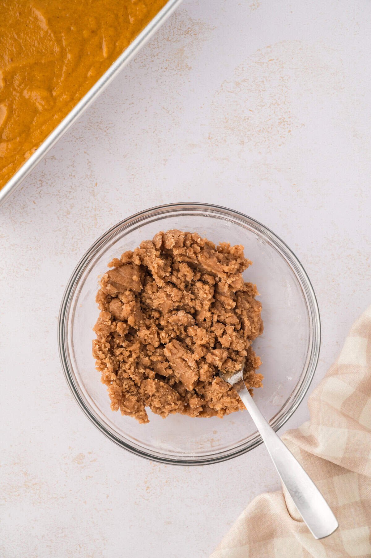 Streusel being mixed in bowl.