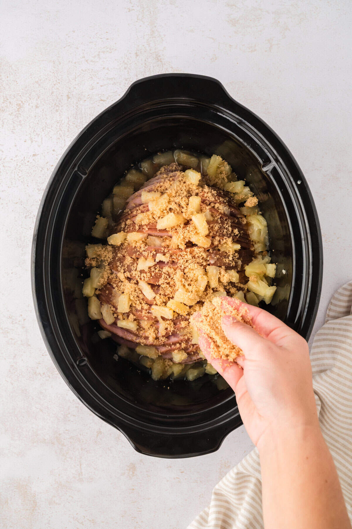 Brown sugar sprinkled over ham.