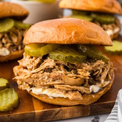 Crockpot Nashville hot chicken sandwich topped with mayo and pickles.