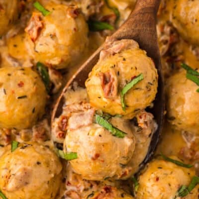 Marry me chicken meatballs on wooden spoon.