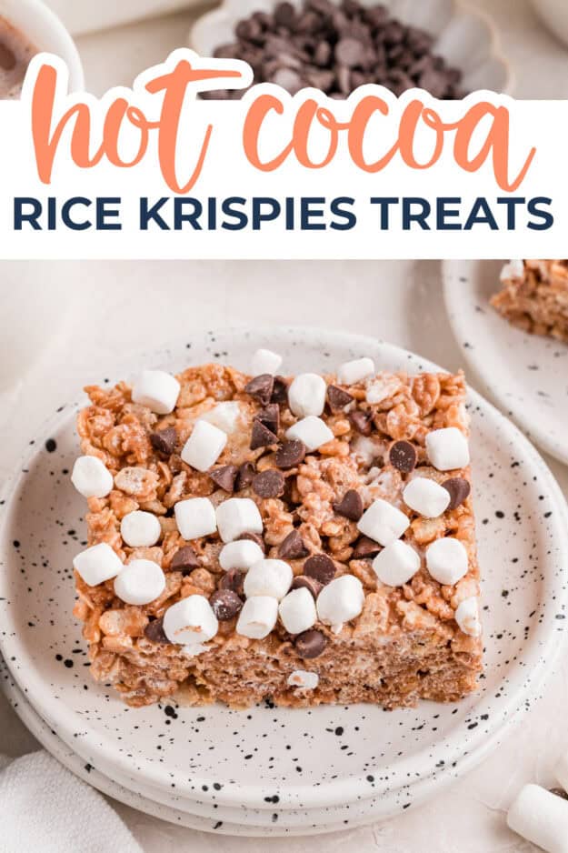 Rice krispies treat made with hot chocolate mix and topped with marshmallows on plate.