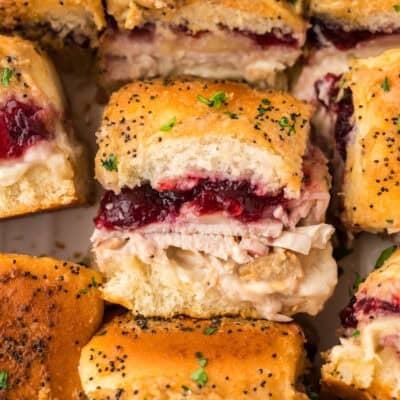 Turkey cranberry sliders in white bakingdish.