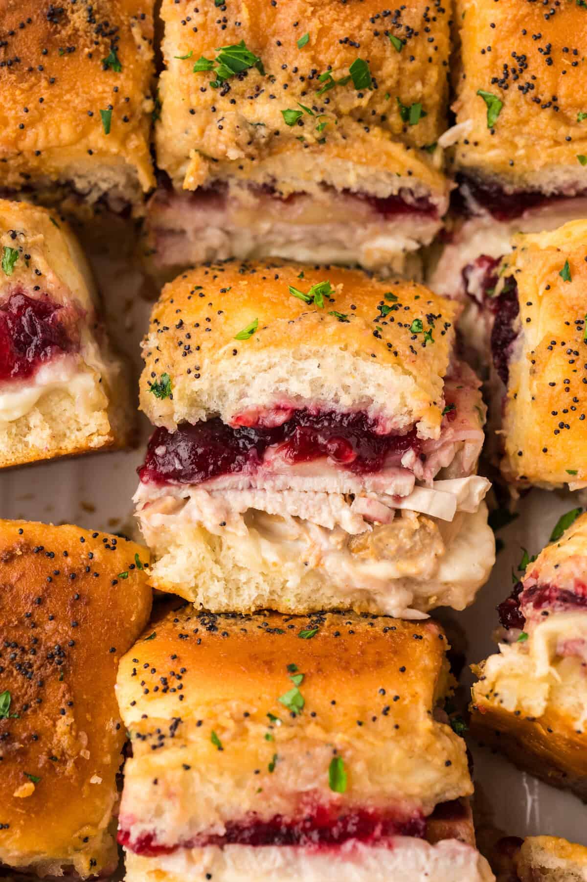 Turkey cranberry sliders in white bakingdish.