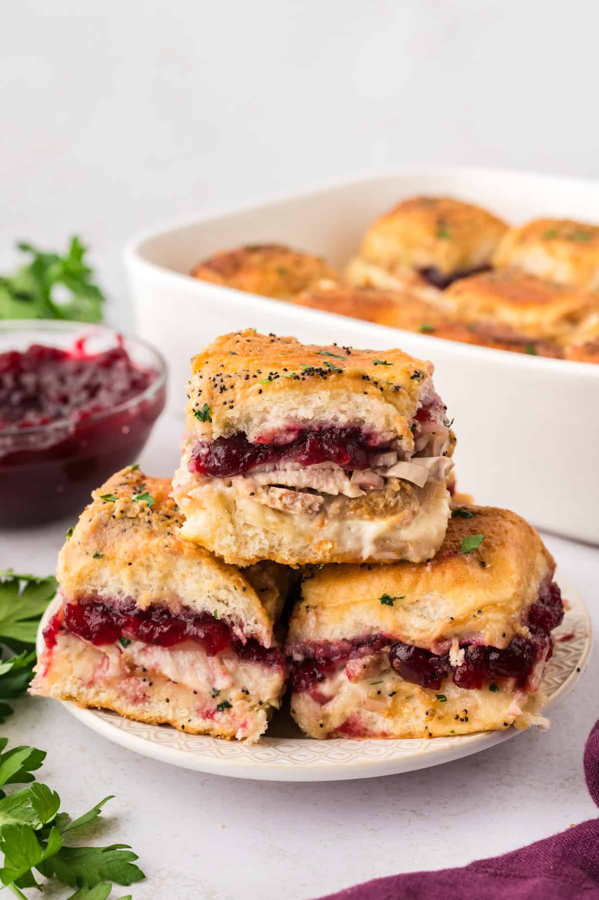 Plate full of turkey cranberry sliders.