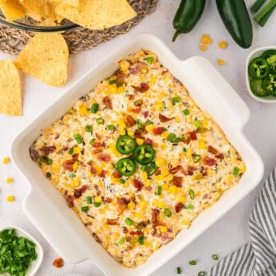 Baked crack corn dip in baking dish.