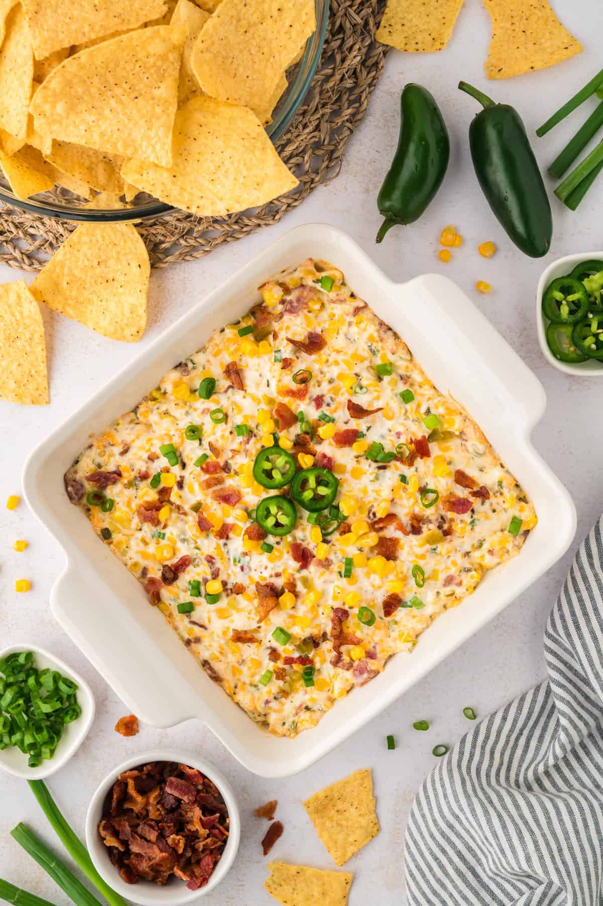 Baked crack corn dip in baking dish.