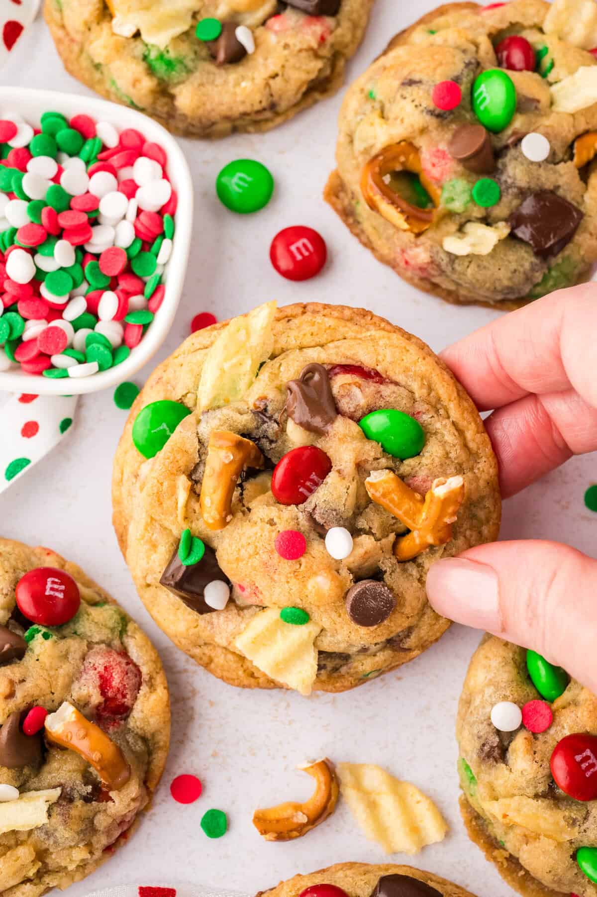 Hand grabbing one of Santa's favorite cookies.
