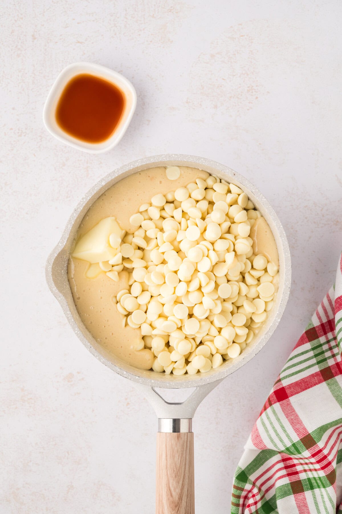 White chocolate chips and butter added to milk.
