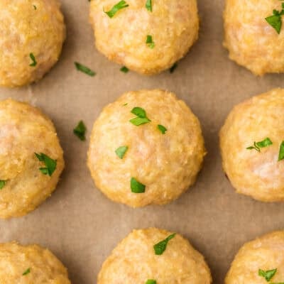 Baked chicken meatballs on sheet pan.