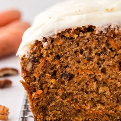 Sliced carrot cake bread on cooling rack.