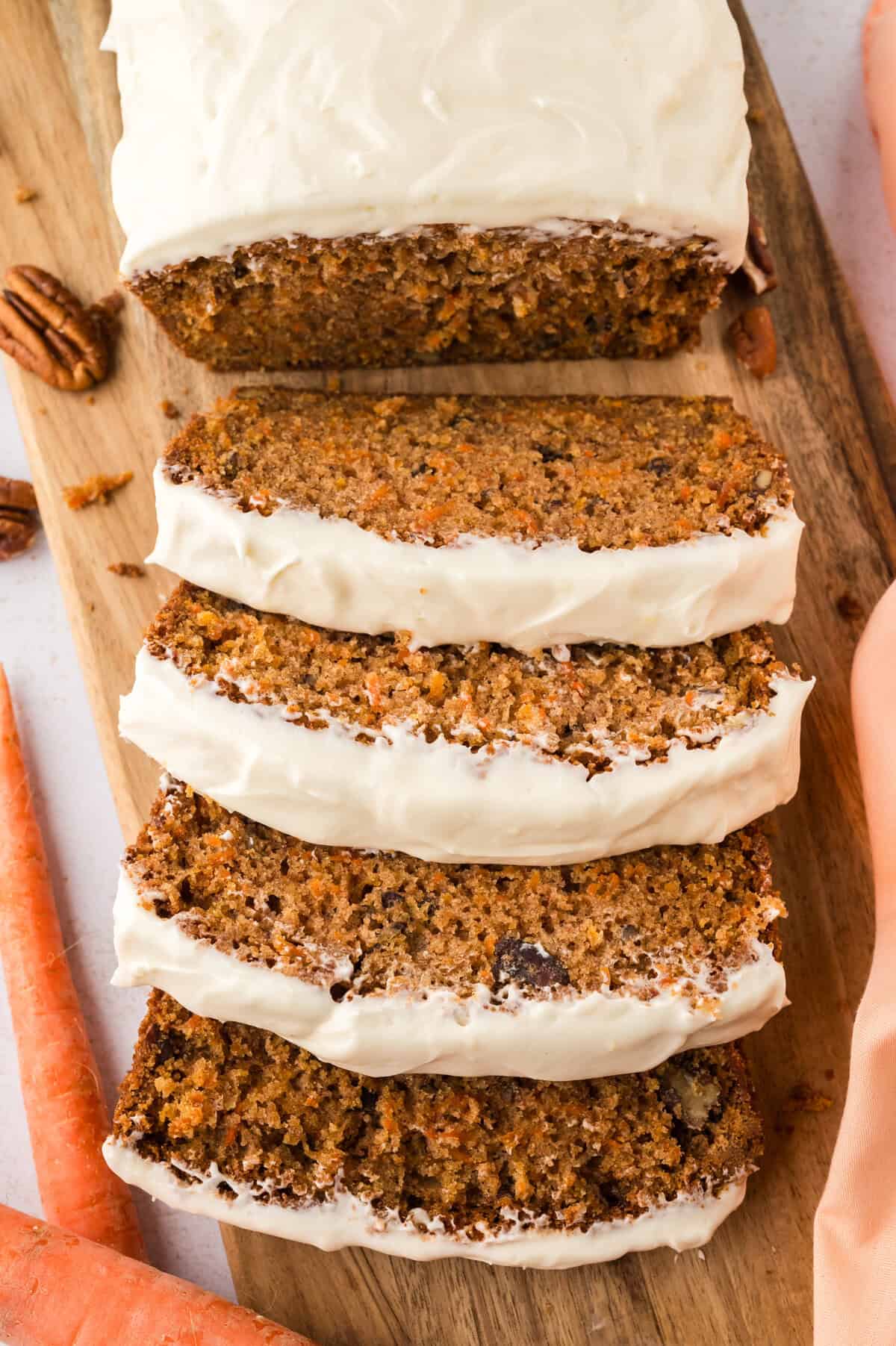 Carrot cake bread topped with cream cheese frosting.