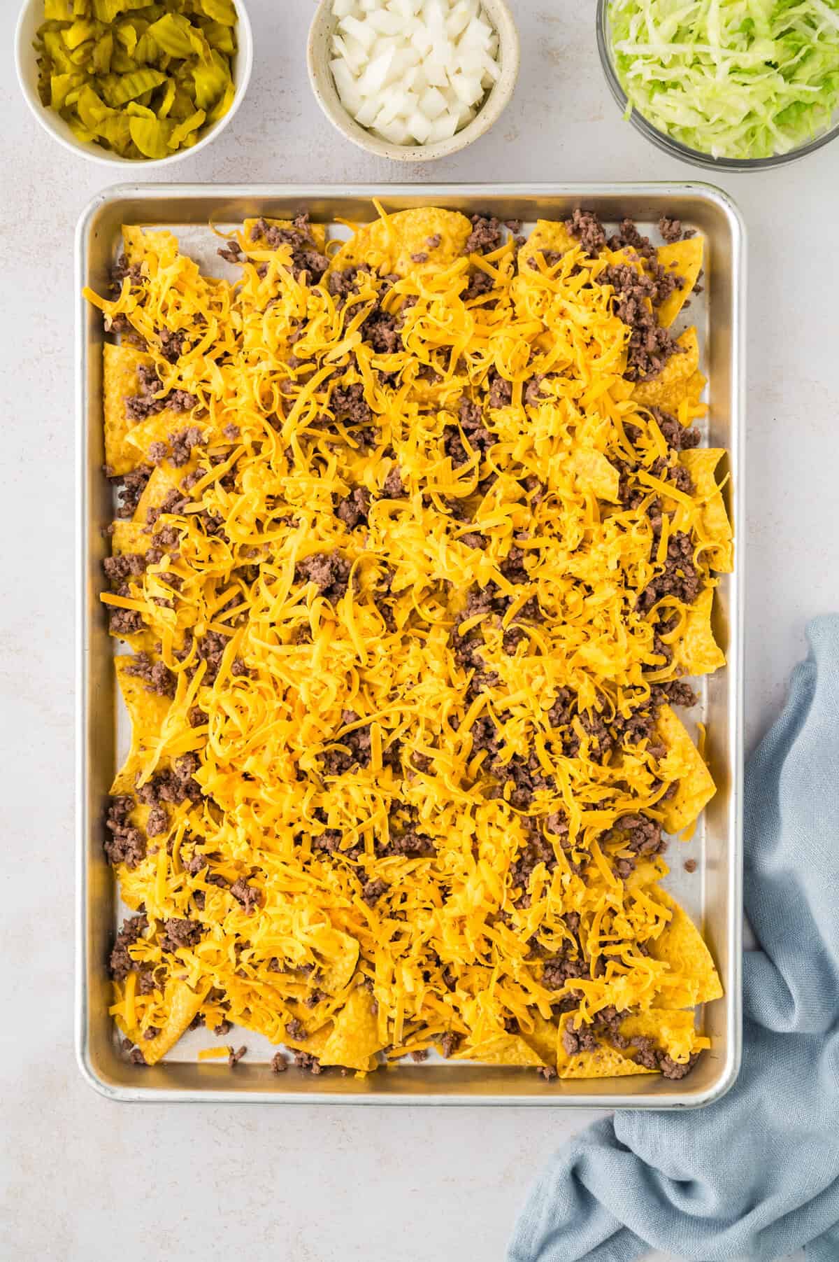 Tortilla chips topped with ground beef and cheddar.