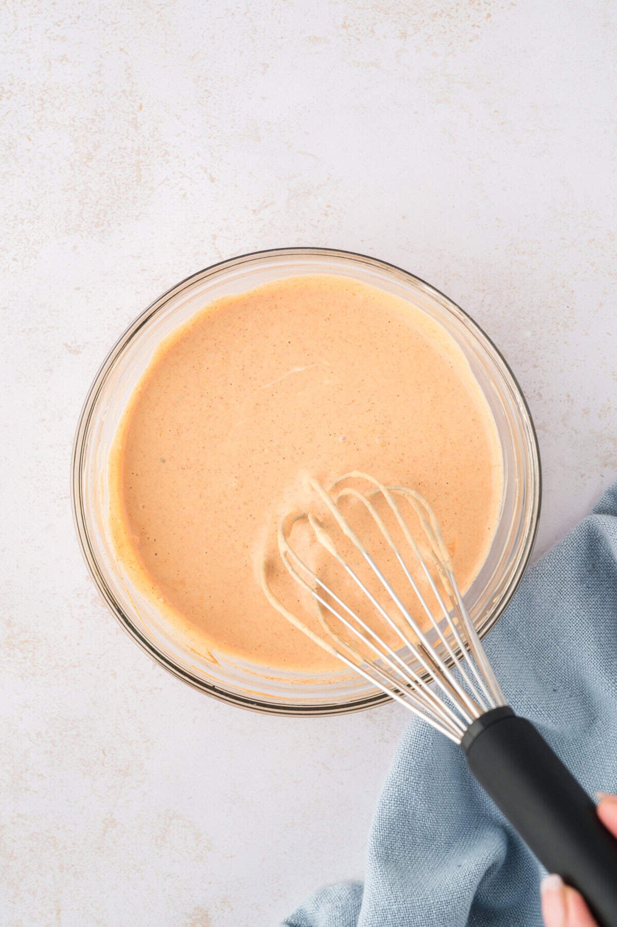 Mac sauce whisked together in bowl.