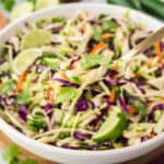 Cilantro lime slaw in white bowl.