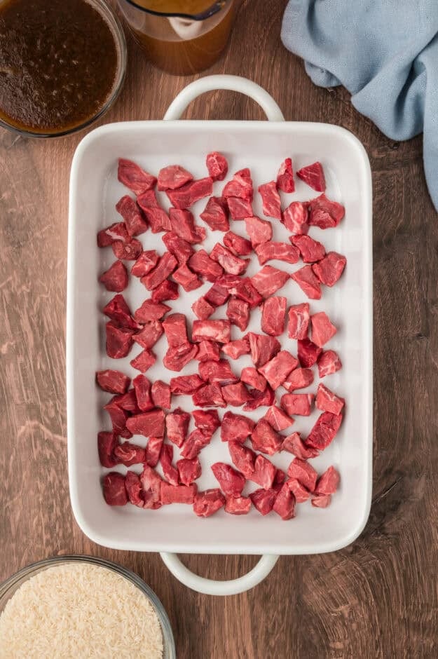 Cubed steak in a baking dish.