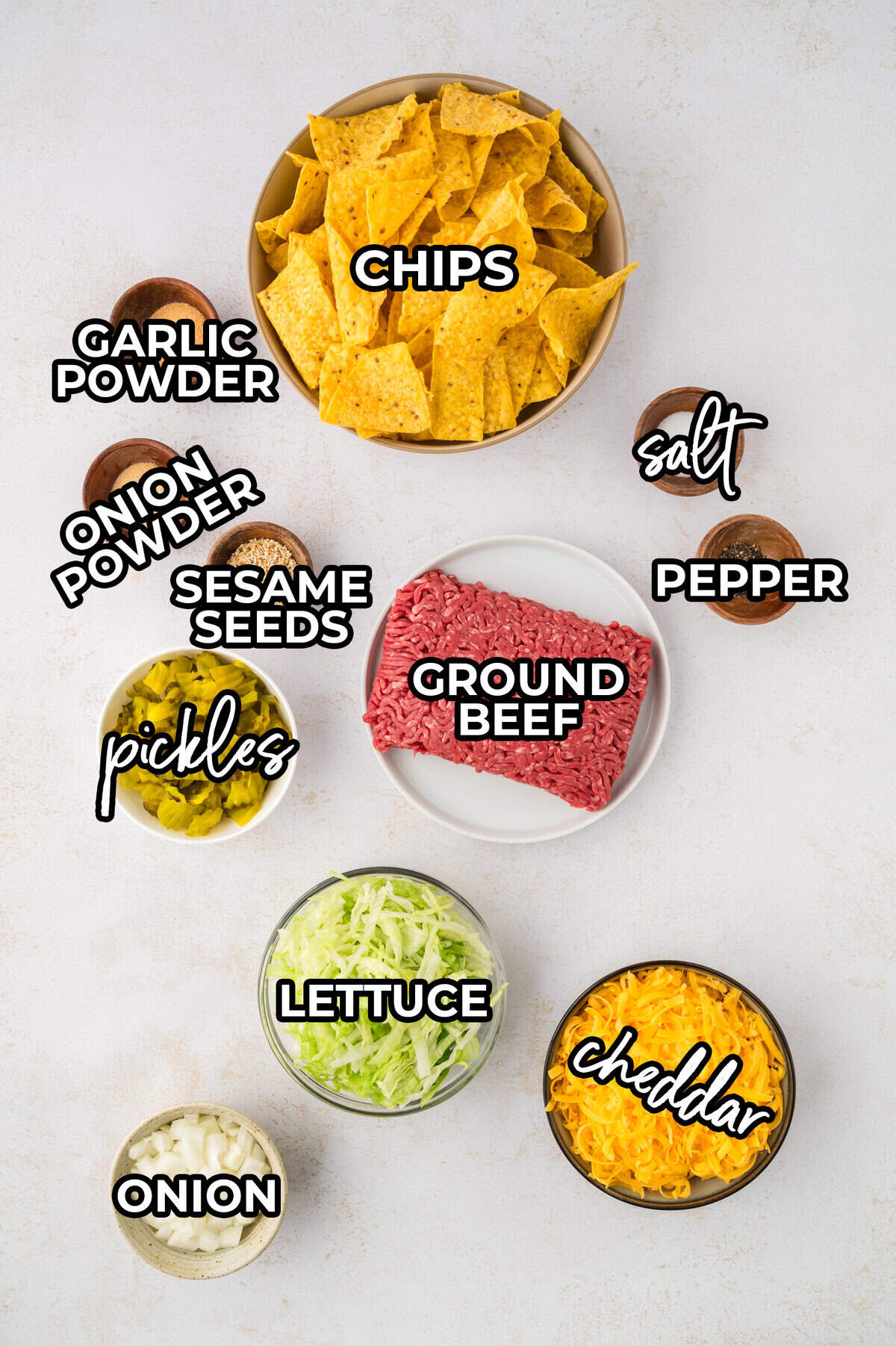 Big Mac Nachos ingredients laid out on counter.