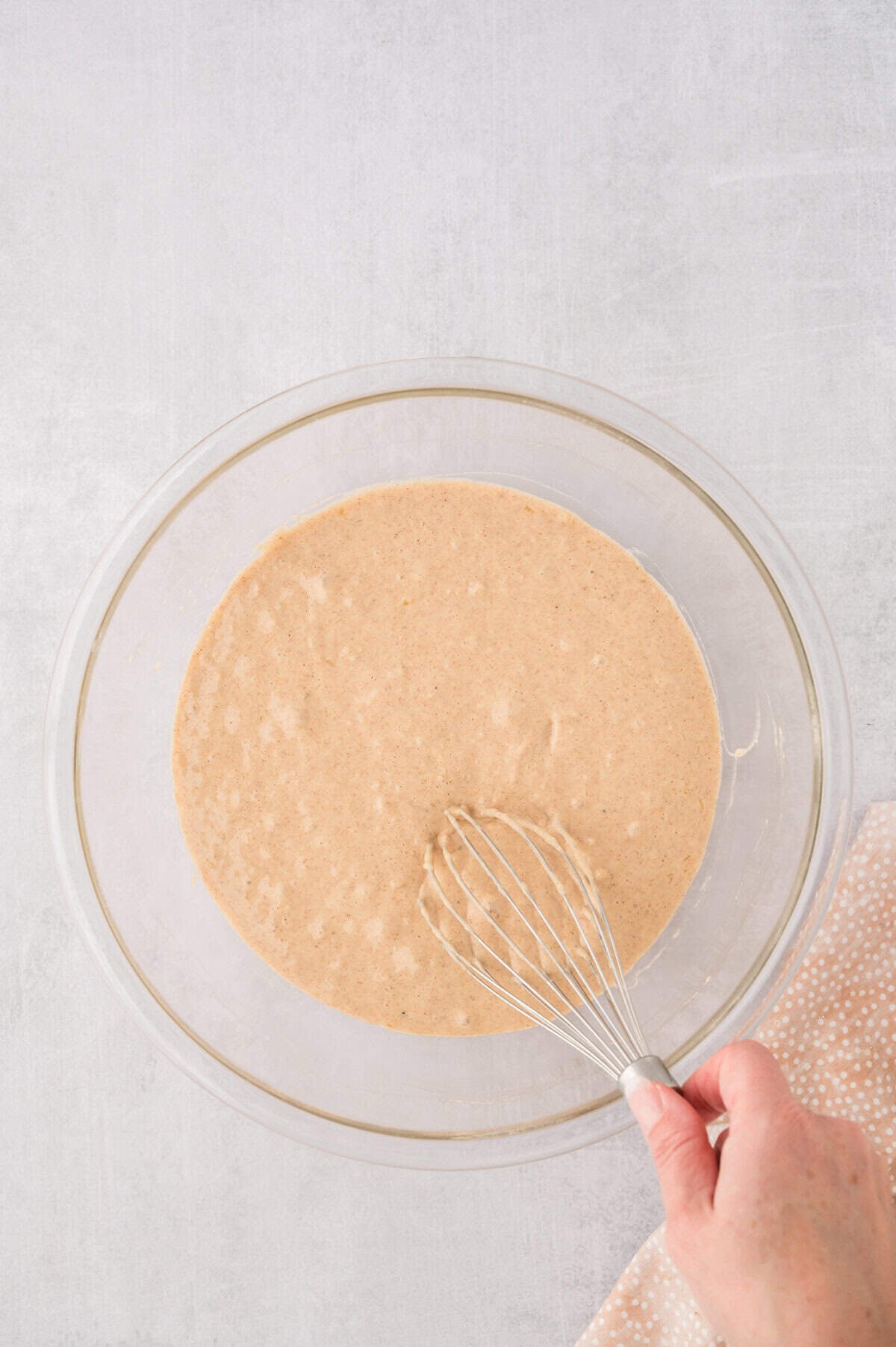 Pancake batter being whisked together.
