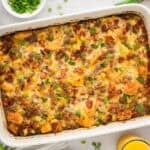 Cowboy breakfast casserole in white baking dish.
