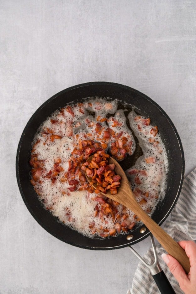 Bacon cooked in a skillet.