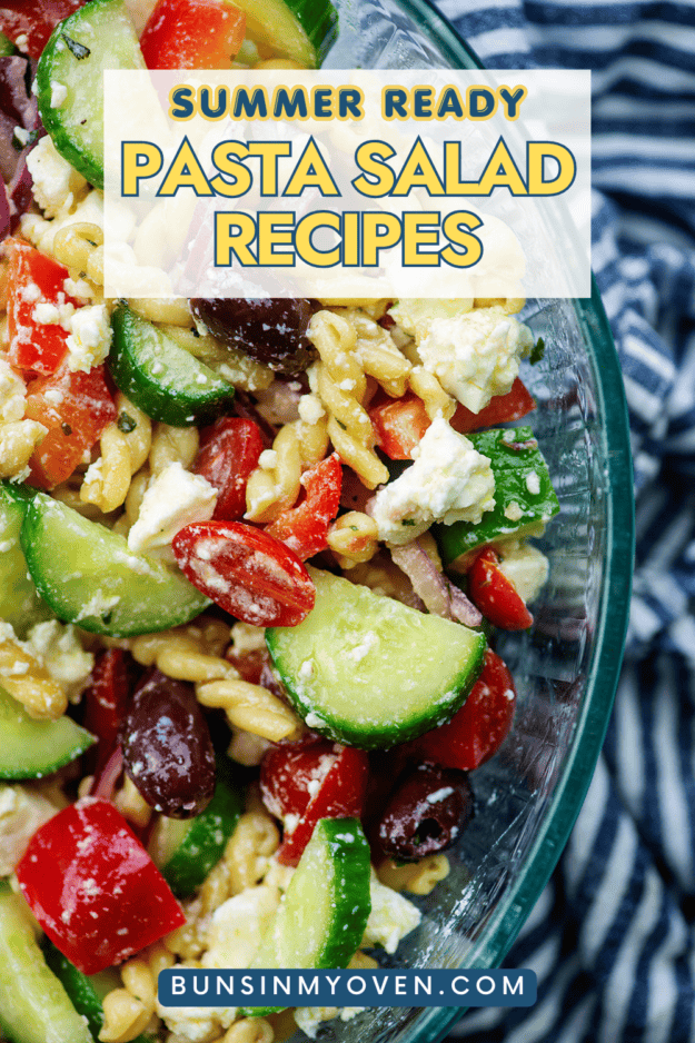 Greek pasta salad in glass bowl.