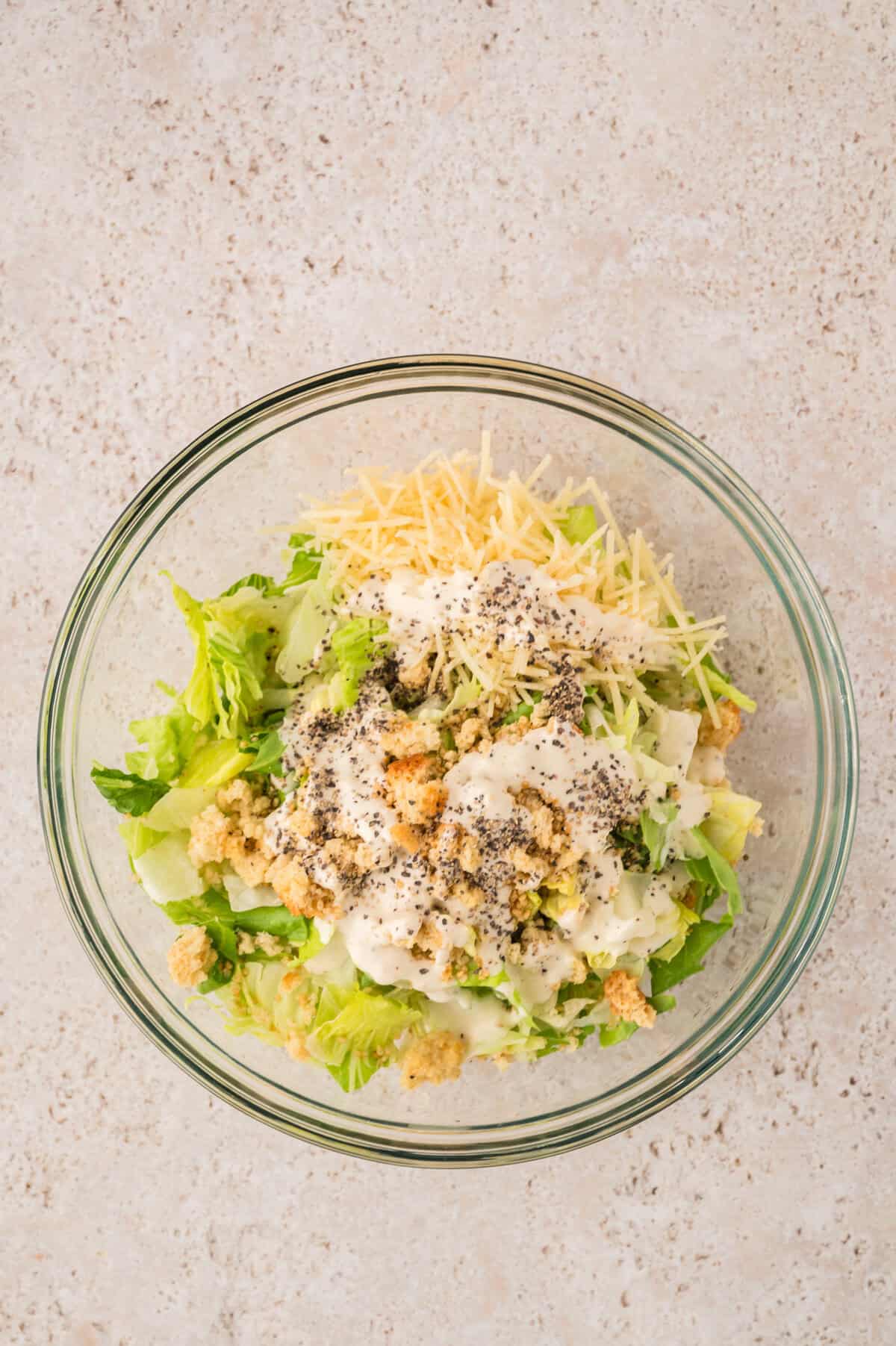 Caesar salad in mixing bowl.