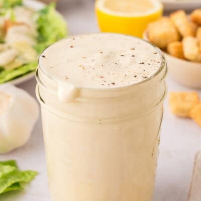 Homemade Caesar dressing in mason jar.