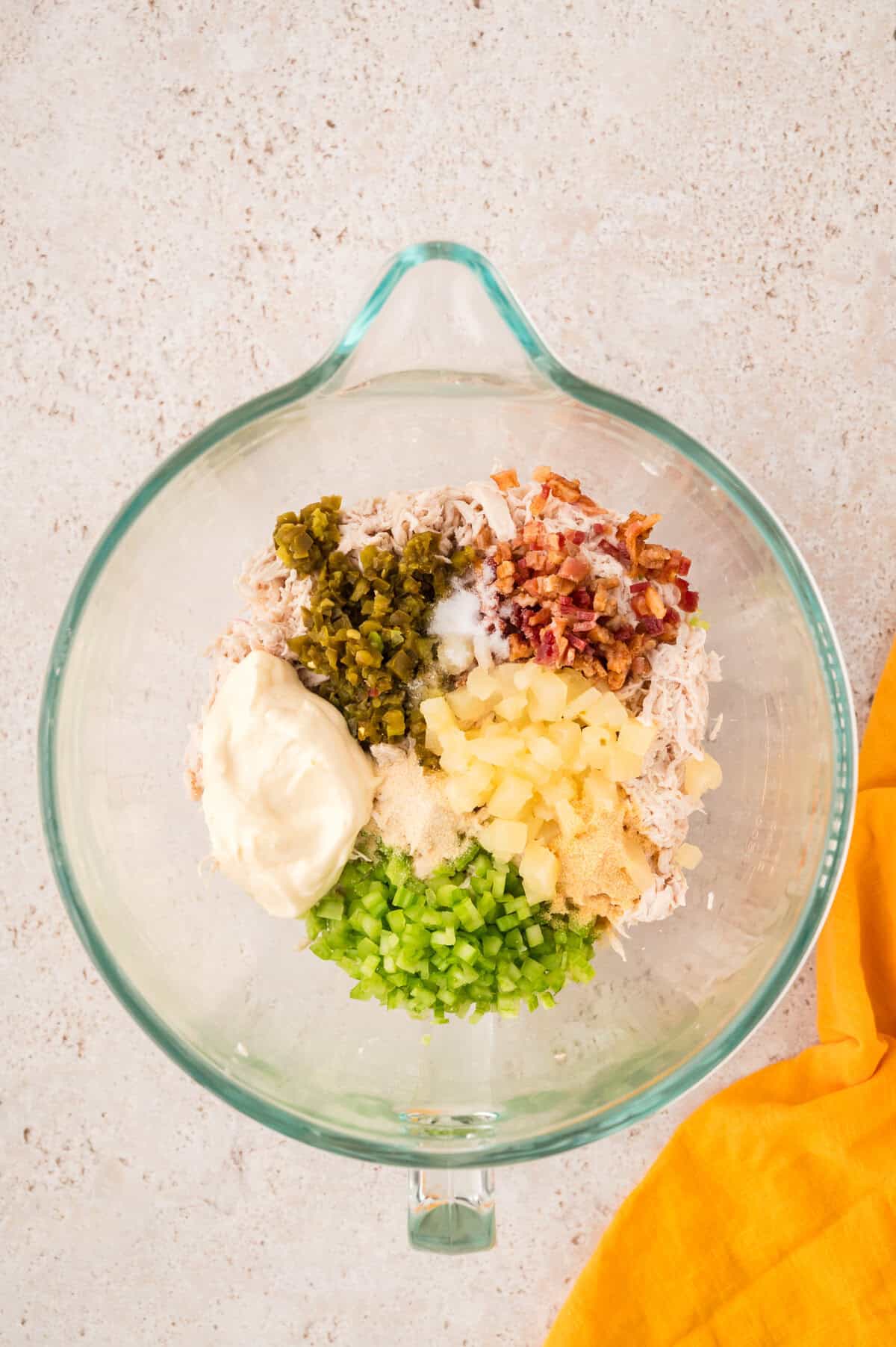 Ingredients for maui mama chicken salad in mixing bowl.