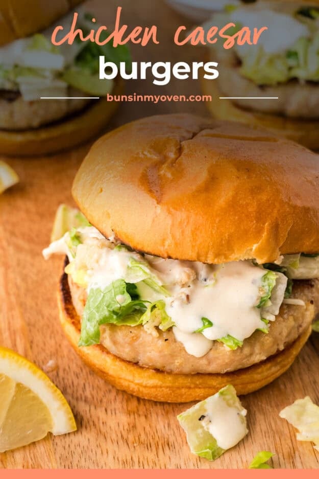 Chicken Caesar burger with salad on top.