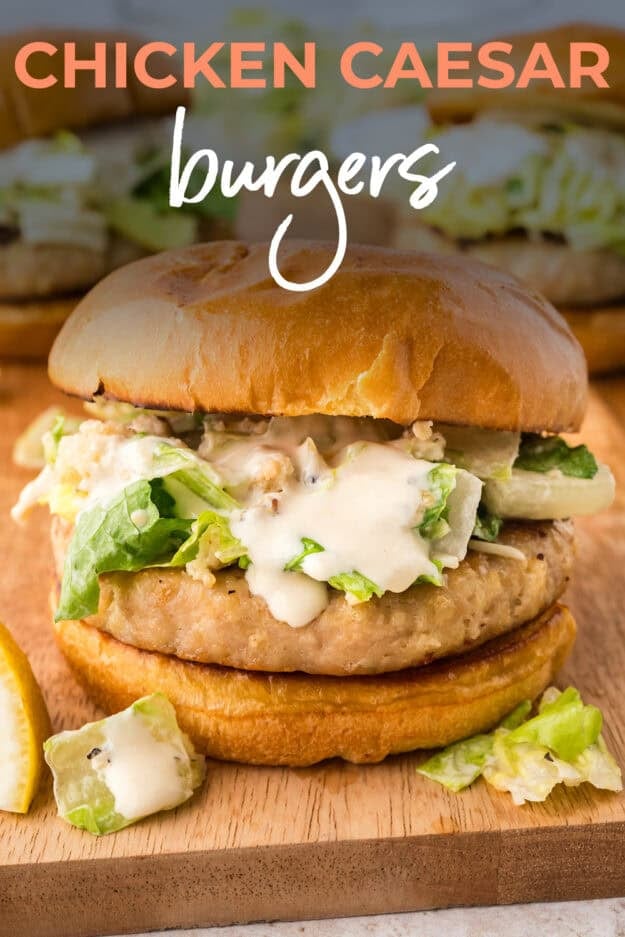 Chicken burger with Caesar salad on top.