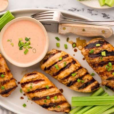 Grilled ranch chicken breasts on platter.