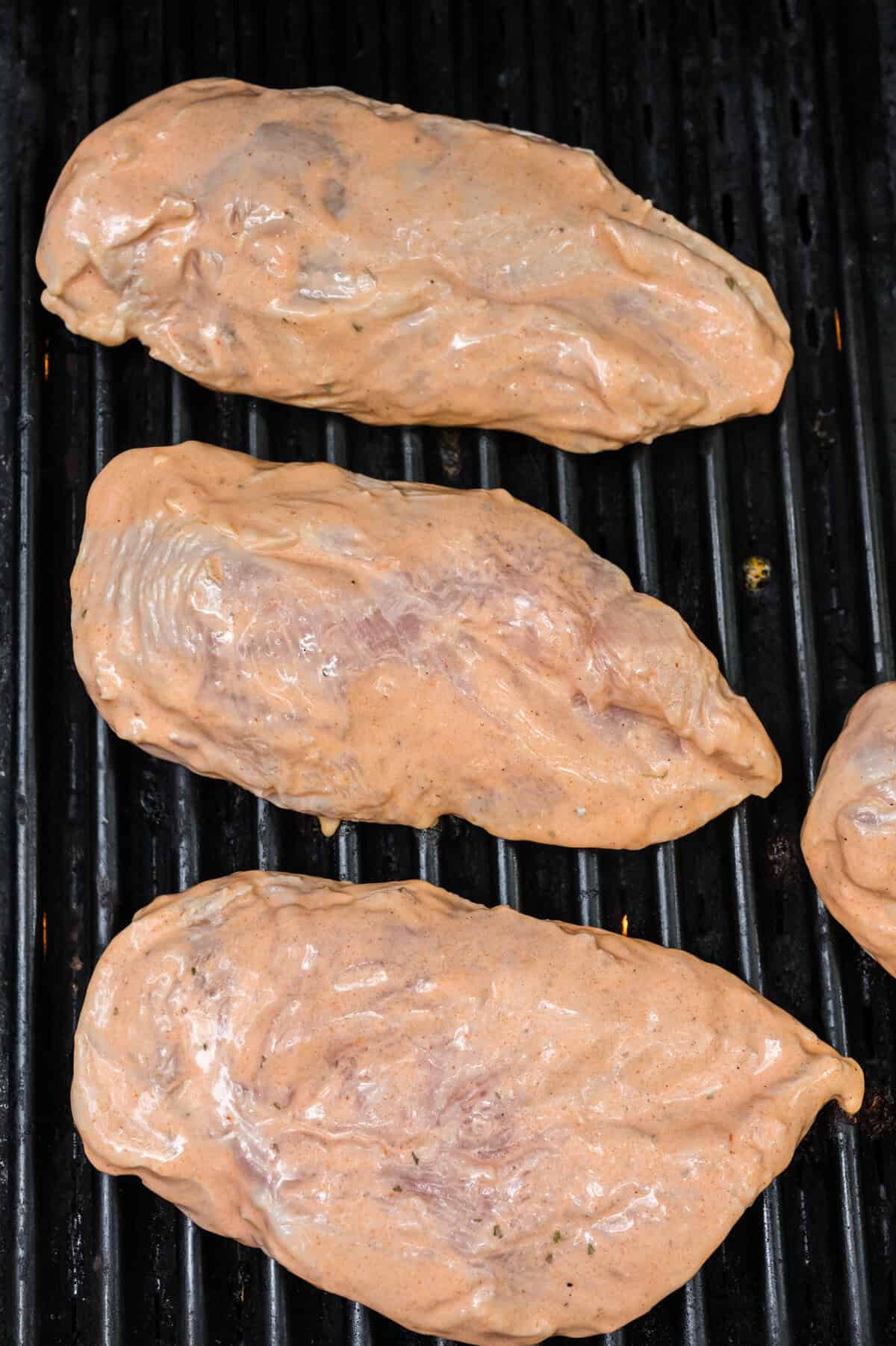 Chicken breasts on grill.