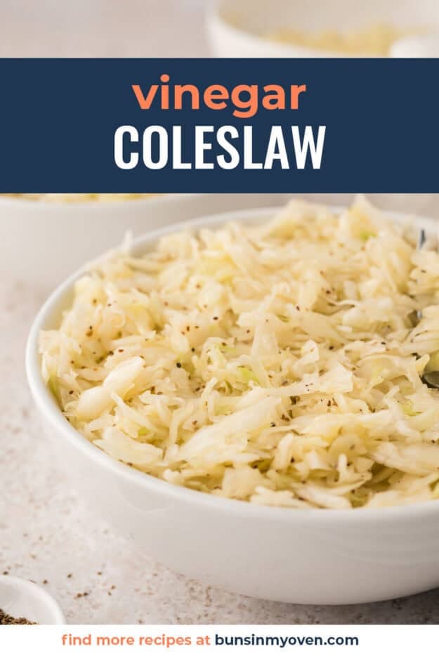 White serving bowl filled with vinegar coleslaw.