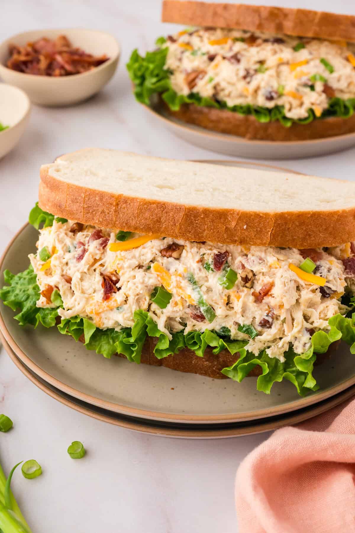 Chicken salad with cream cheese in sandwich.