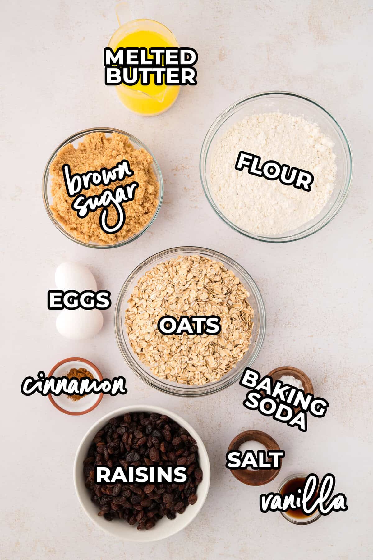 Ingredients for oatmeal raisin bars laid out on counter.