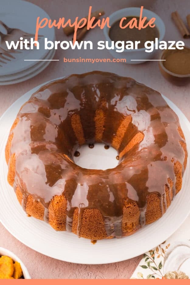 Glazed pumpki ncake on cake plate.
