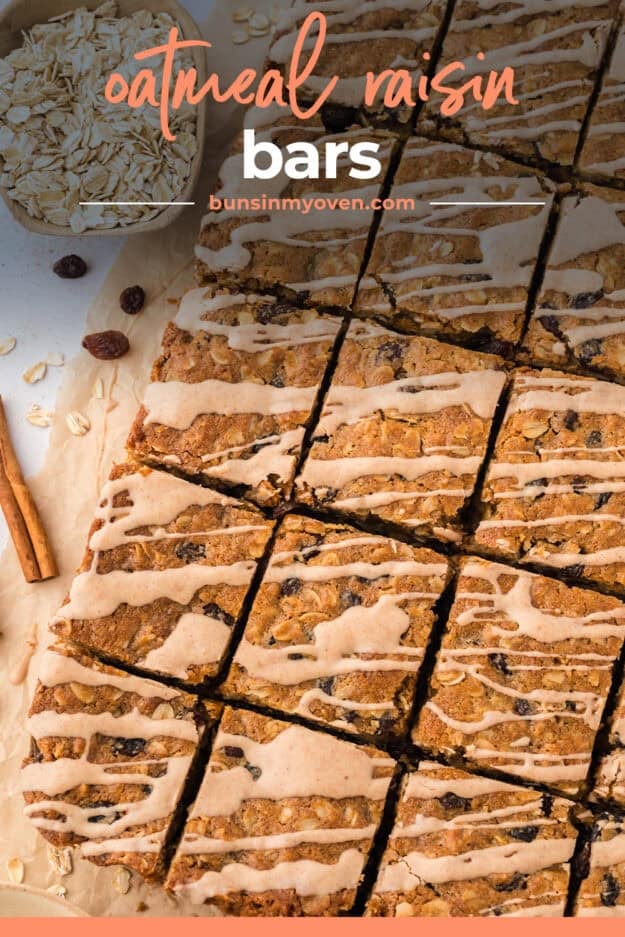 Glazed oatmeal cooke bars on parchment paper.
