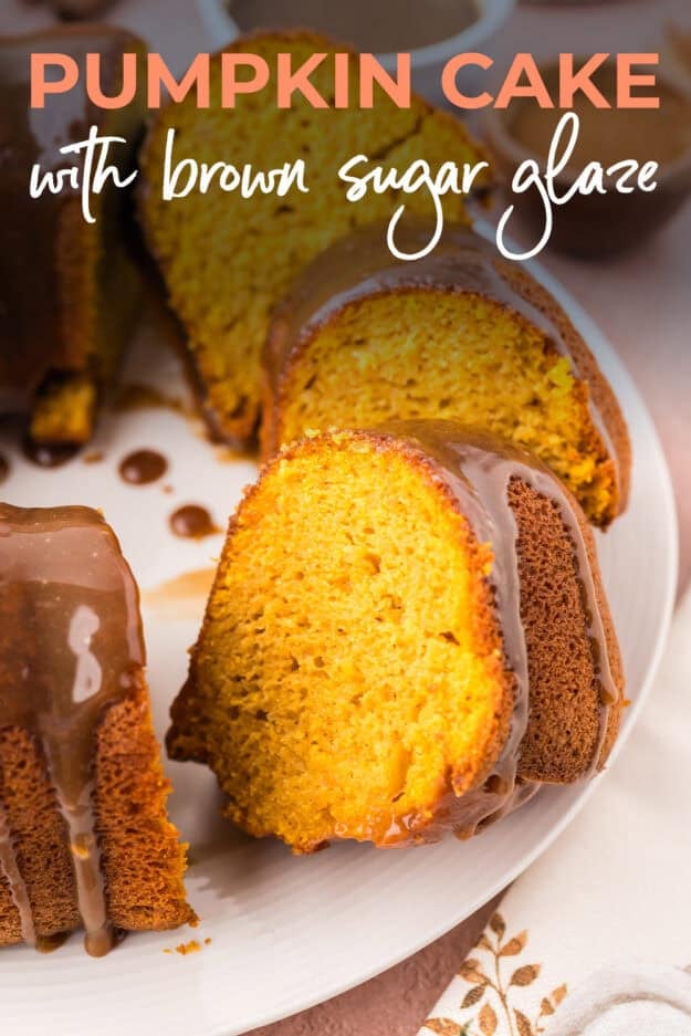 Sliced pumpkin cake on cake plate.