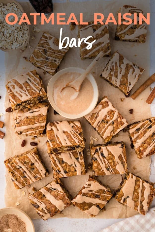 Glazed oatmeal cookie bars on parchment paper.