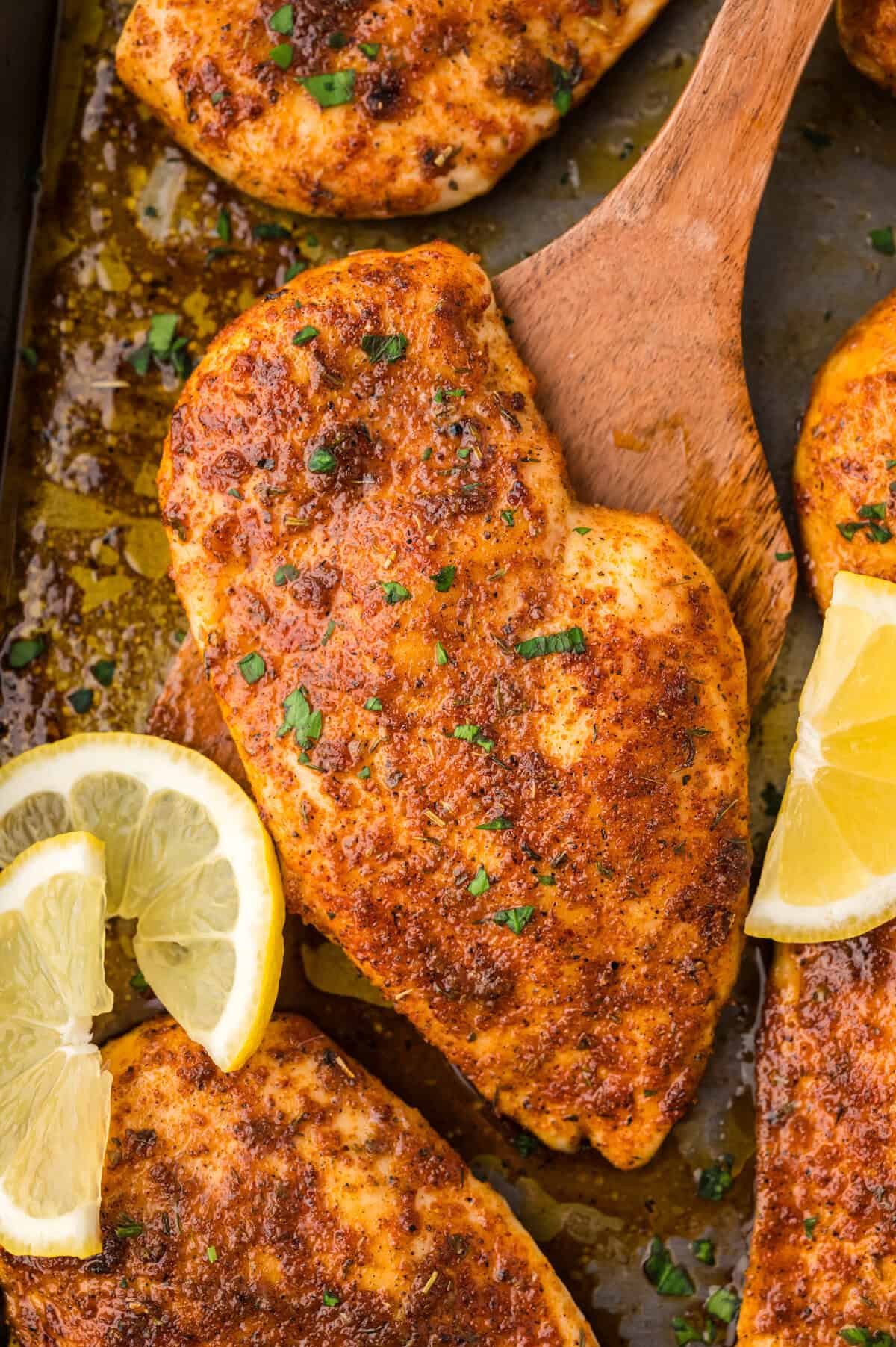 Oven baked chicken breast on sheet pan.