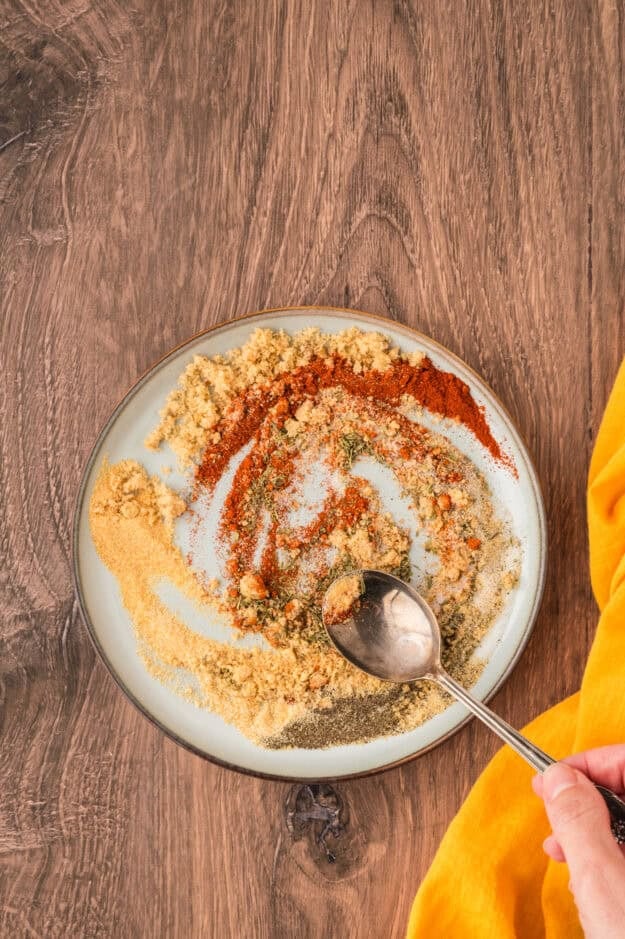 Spice mix for chicken on small plate.