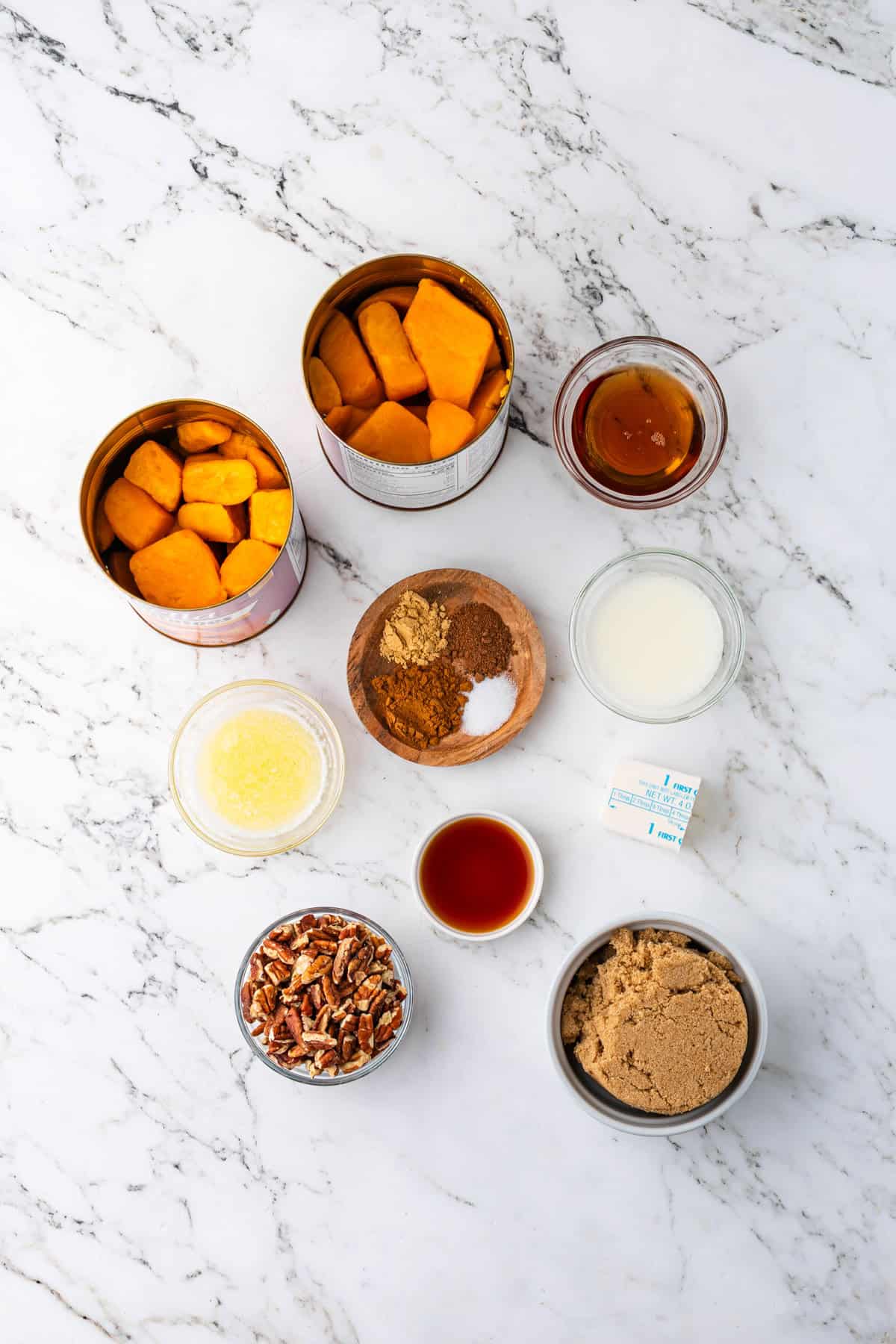 Ingredients for candied yams made from canned yams laid out on counter.