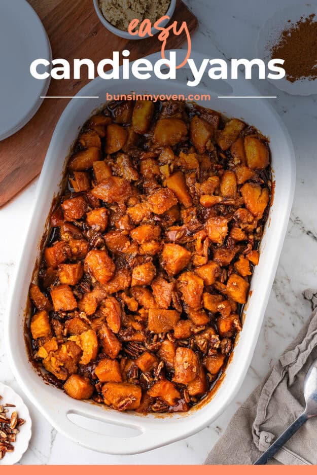 Candied yams made from a can in a white casserole dish.