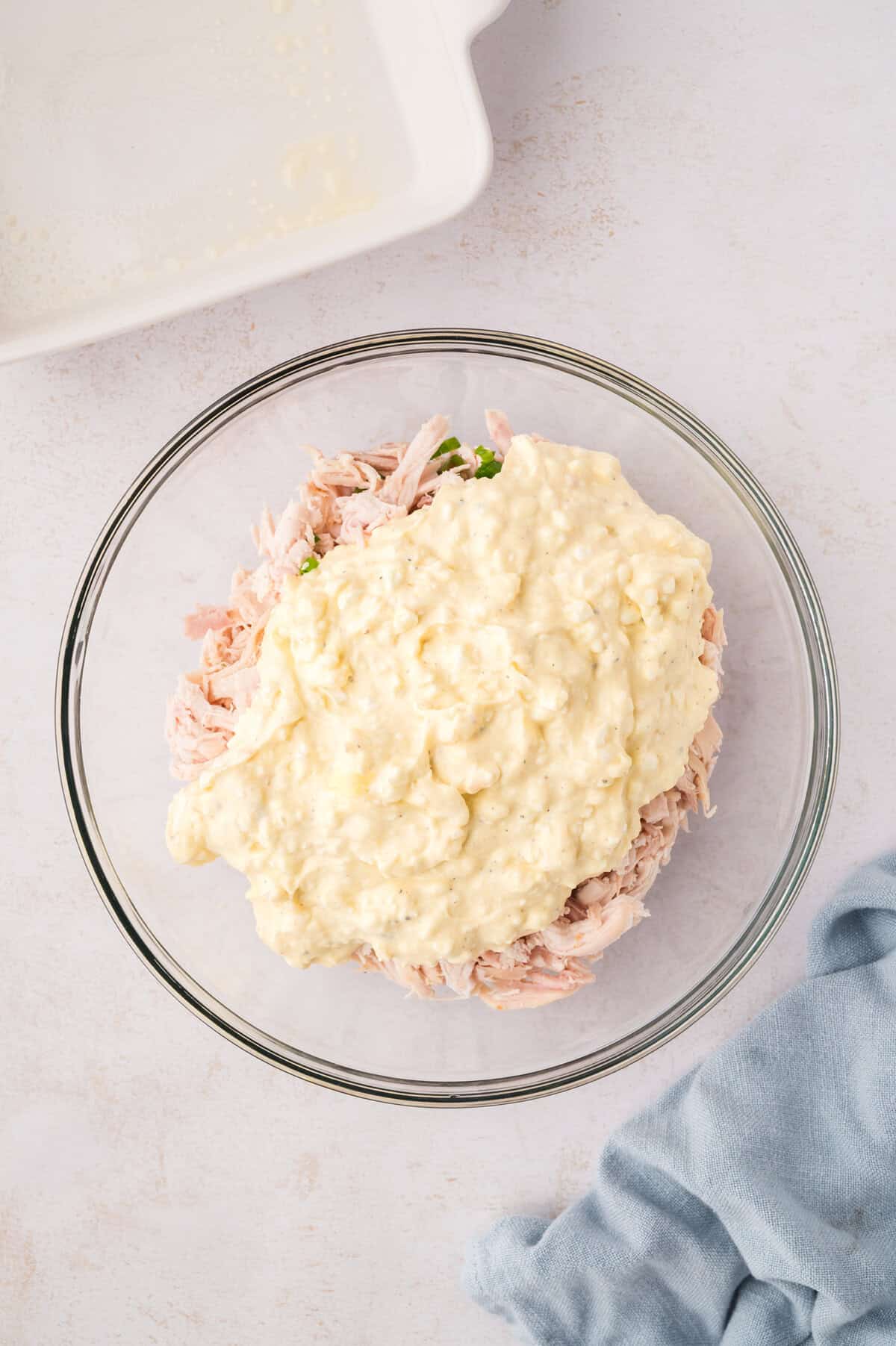 Creamy sauce poured over chicken.